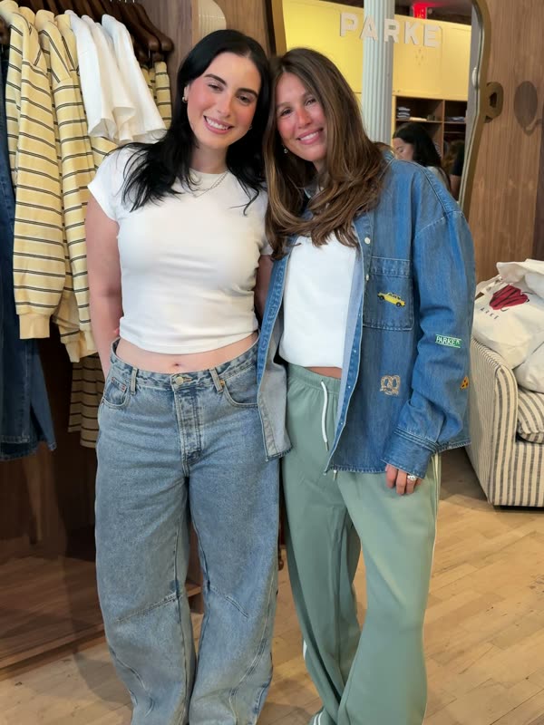 Jessie and Chelsea Parke smiling together inside the PARKE store